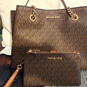 Authentic Michael Kors purse with matching wristlet.